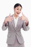 Cheering businesswoman giving thumbs up