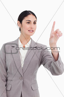 Young businesswoman operating touch screen