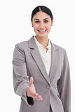Smiling businesswoman offering her hand