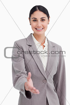 Smiling businesswoman offering her hand