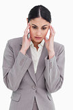 Young saleswoman experiencing a headache