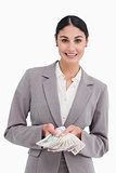 Smiling businesswoman showing her money
