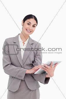 Smiling tradeswoman with her tablet computer