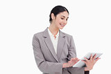 Smiling young businesswoman using tablet computer