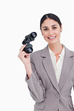 Smiling businesswoman with spy glasses
