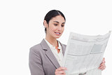 Businesswoman reading news paper