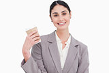 Smiling businesswoman with paper cup