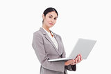 Side view of businesswoman with laptop