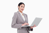 Surprised businesswoman looking at her laptop