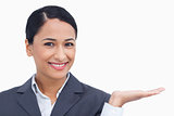 Close up of smiling saleswoman with her palm up