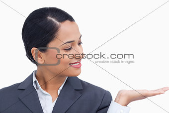 Close up of saleswoman looking at her palm