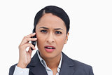 Close up of saleswoman getting bad news from caller