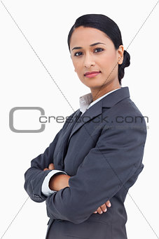 Close up of serious saleswoman with arms folded