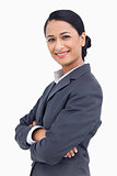 Close up of smiling saleswoman with arms crossed