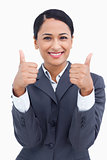 Close up of smiling saleswoman giving thumbs up