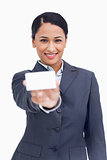 Close up of smiling saleswoman showing her business card
