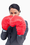 Close up of belligerent saleswoman with boxing gloves