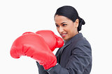 Close up side view of saleswoman with boxing gloves