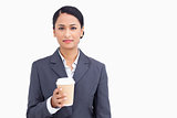 Close up of saleswoman with paper cup