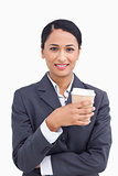 Close up of smiling saleswoman and paper cup