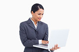 Close up of saleswoman using her laptop