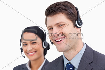 Close up of smiling call center employees