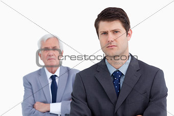 Close up of businessman with his boss behind him