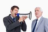 Close up of businessman with megaphone yelling at his boss