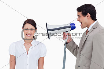 Salesman yelling at colleague with megaphone