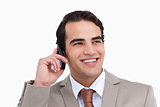 Close up of smiling salesman on his cellphone