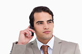 Close up of serious salesman on his cellphone