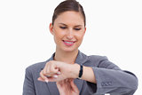 Smiling businesswoman checking her watch