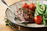 Rustic steak with vegetables and herbs