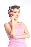 Funny girl with hair curlers on her head