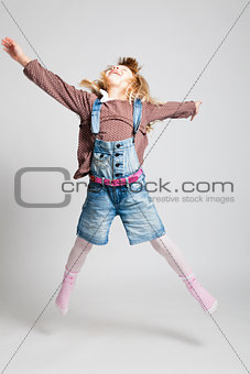 Happy young girl jumping