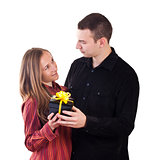 Young man giving a present to woman