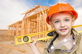 Child Boy Dressed Up as Handyman in Front of House Framing