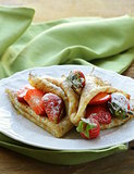 dessert crepes with strawberries and powdered sugar