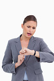 Shocked businesswoman checking her watch