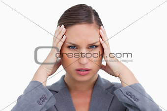 Close up of tradeswoman with headache