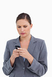 Close up of tradeswoman reading text message