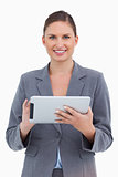 Smiling tradeswoman with her touchscreen computer