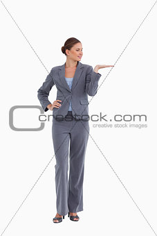 Tradeswoman presenting with her palm up