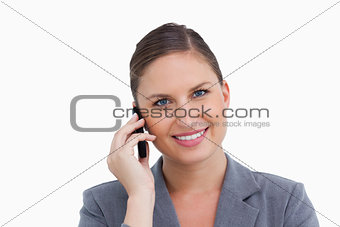 Close up of smiling tradeswoman on her cellphone