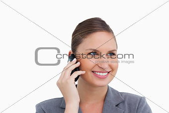 Close up of smiling tradeswoman on her mobile phone