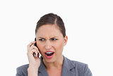 Close up of angry tradeswoman yelling at caller