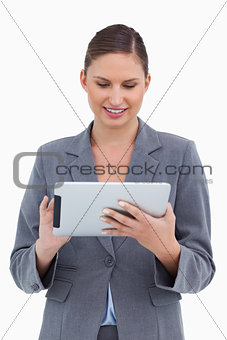 Smiling tradeswoman using her tablet computer