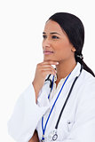 Close up of female physician in thinkers pose