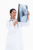 Female physician taking a look at x-ray