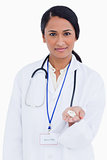 Close up of female physician holding pills in her palm